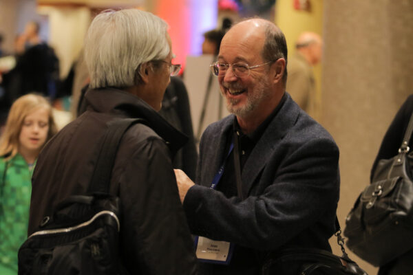 two people conversing and laughing