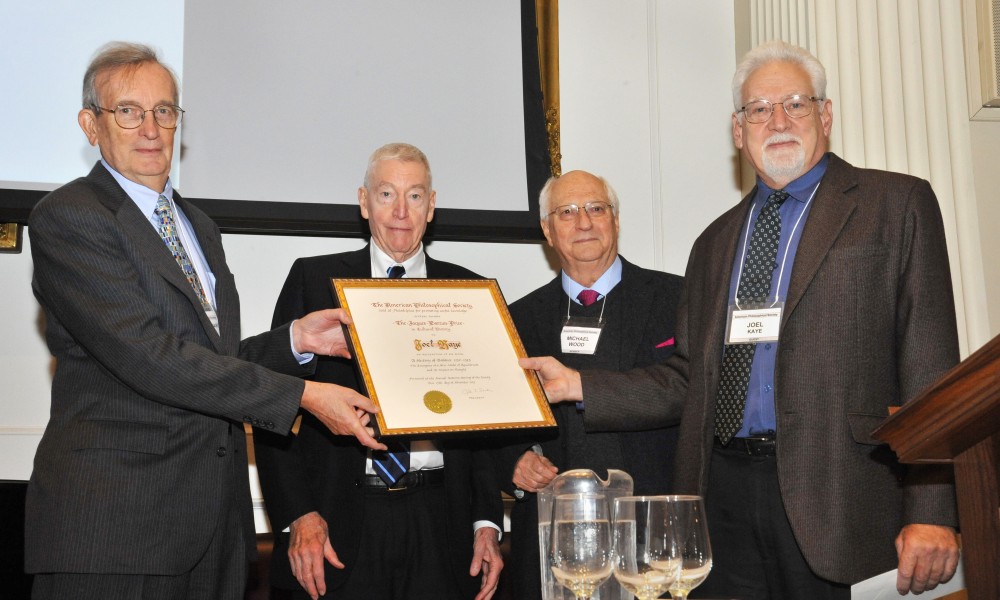 four men at award ceremony