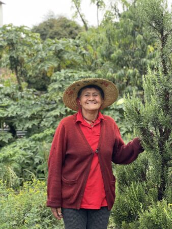Chavelita stands by her garden located in Suba, Bogota, Colombia in October 2021.