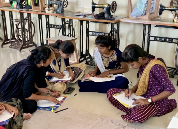Young multilingual Banjara women in Maharashtra, India discuss where they use different languages and draw maps of these locations in their communities.