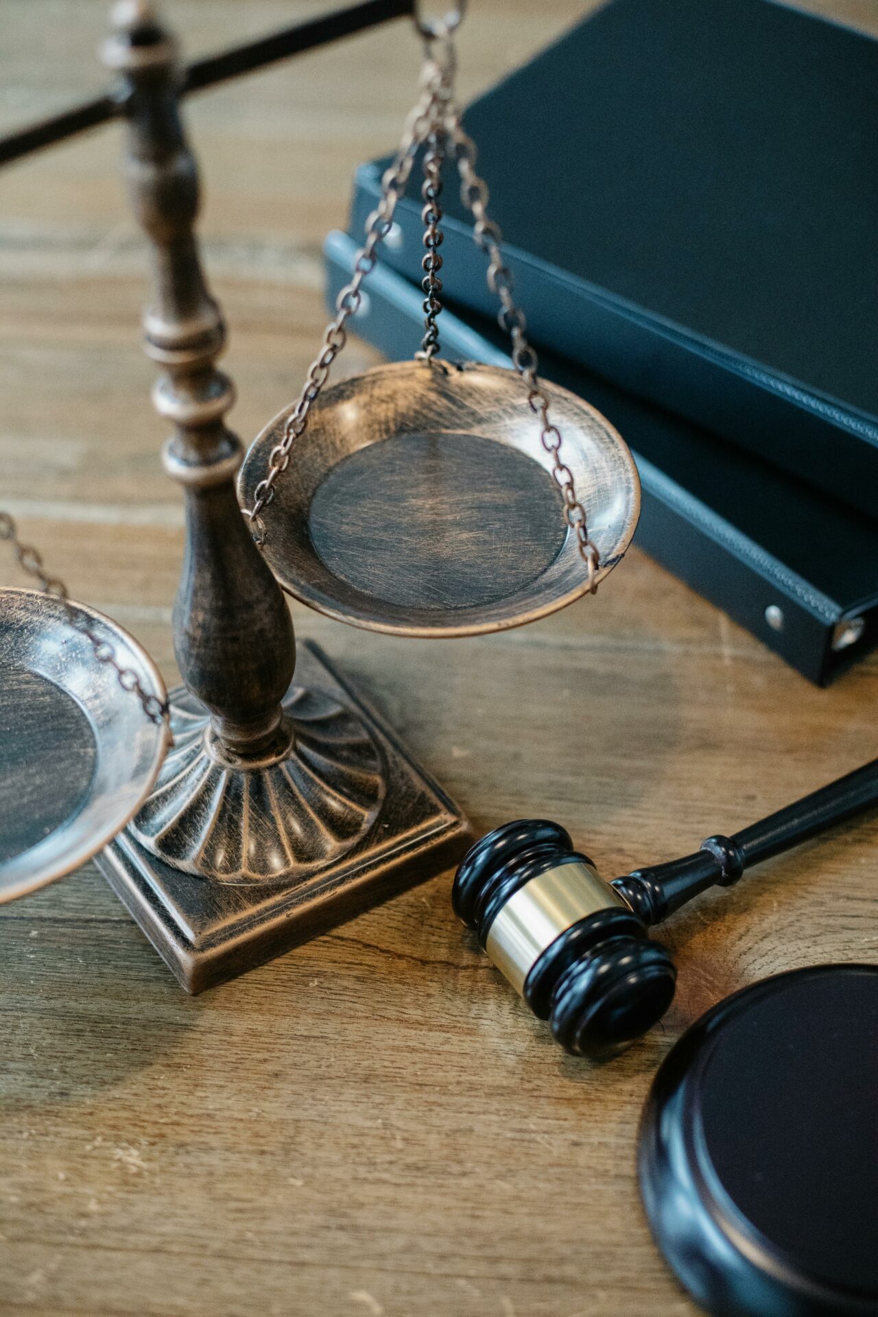 Justice Scales and Gavel on Wooden Surface